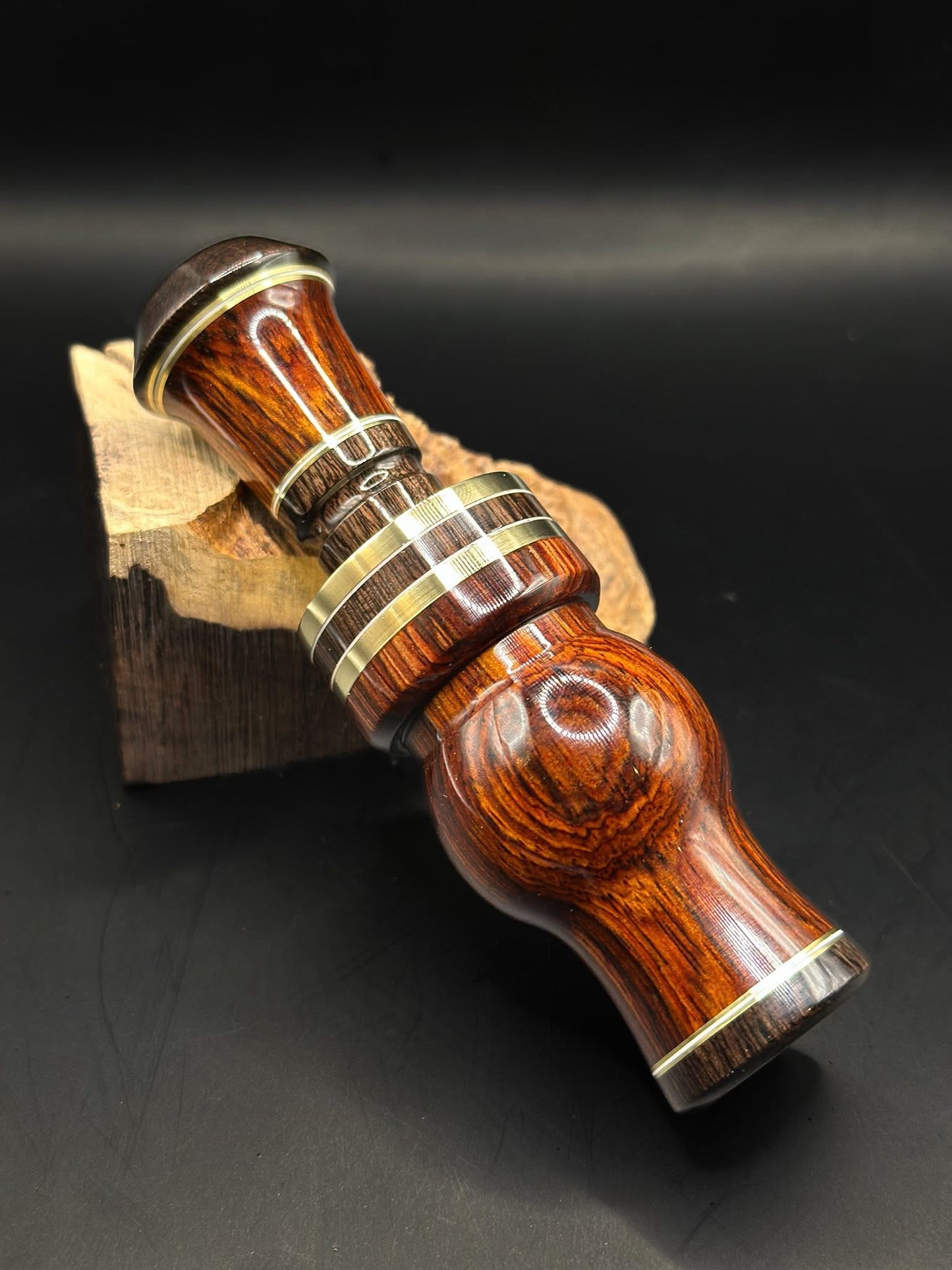 Mud Hen Cocobolo Barrel African Blackwood Caps Brass and white inlays. 3 pieces Brass band ABW center with white inlays.
African Blackwood insert Cocobolo sleeve ABW cap brass and white inlays.